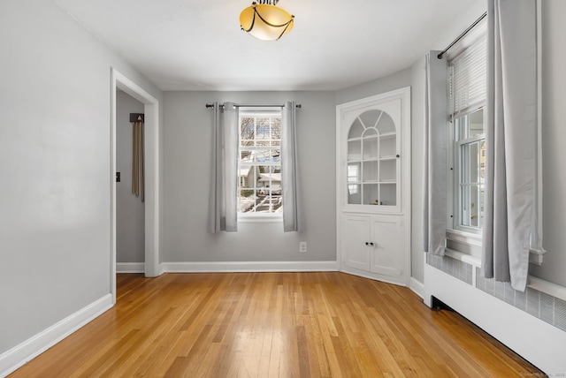 spare room with light hardwood / wood-style flooring