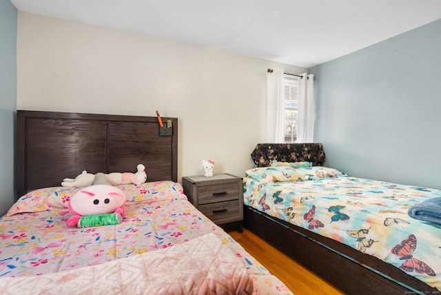 bedroom featuring hardwood / wood-style floors