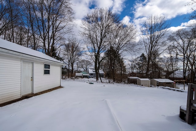 view of yard layered in snow