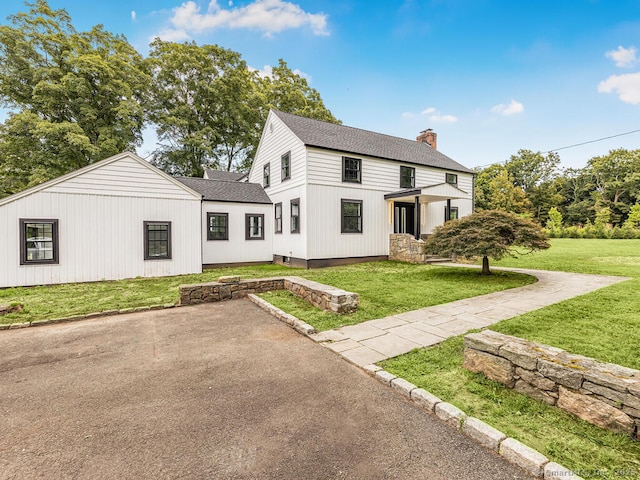 view of front of property with a front lawn and a patio