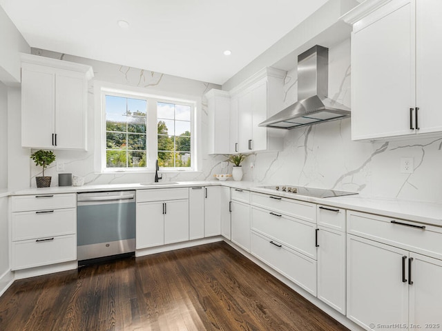 kitchen with sink, white cabinets, stainless steel dishwasher, wall chimney range hood, and black electric cooktop