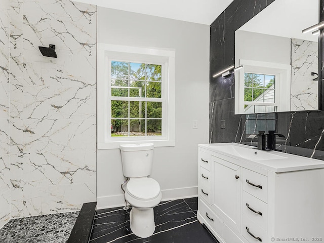 bathroom featuring vanity, toilet, and walk in shower