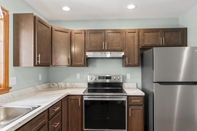 kitchen featuring appliances with stainless steel finishes and sink