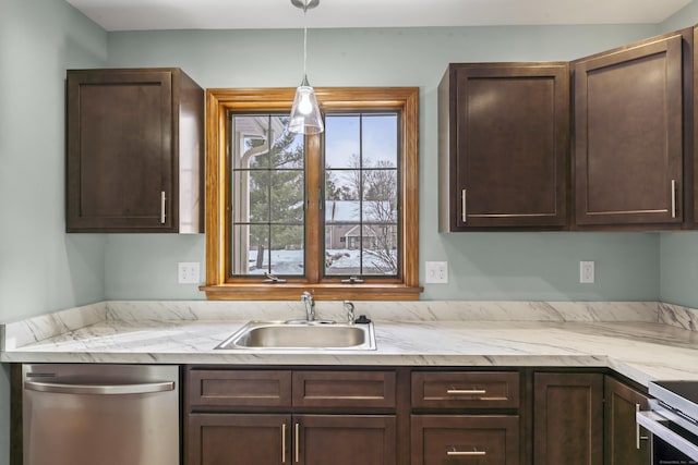 kitchen featuring dark brown cabinets, sink, stainless steel dishwasher, and decorative light fixtures