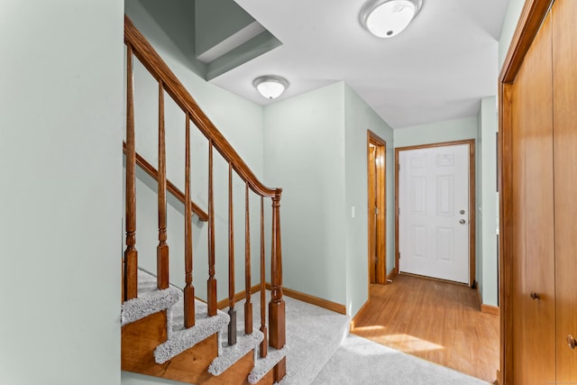 view of carpeted foyer entrance