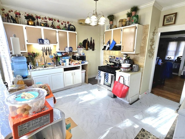 kitchen with sink, hanging light fixtures, ornamental molding, appliances with stainless steel finishes, and white cabinets