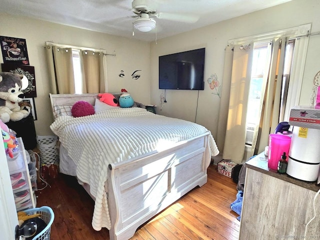 bedroom with hardwood / wood-style flooring and ceiling fan