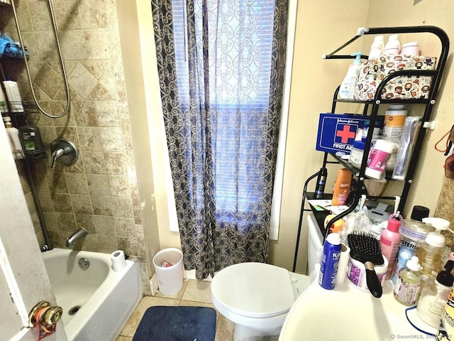 bathroom featuring shower / tub combo with curtain, tile patterned floors, and toilet