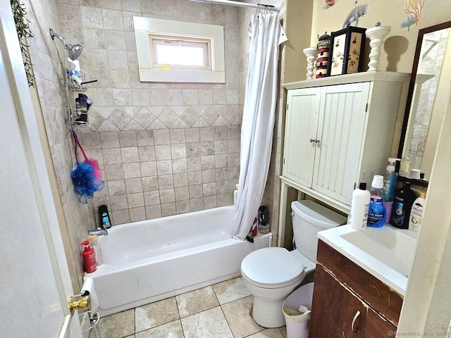 full bathroom with tile patterned flooring, vanity, shower / tub combo, and toilet