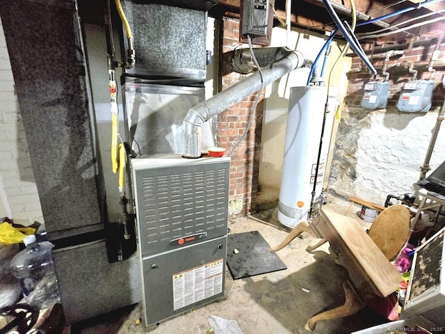 utility room featuring heating unit and water heater