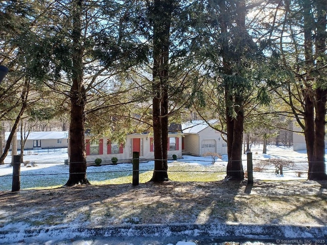 exterior space with a garage and fence