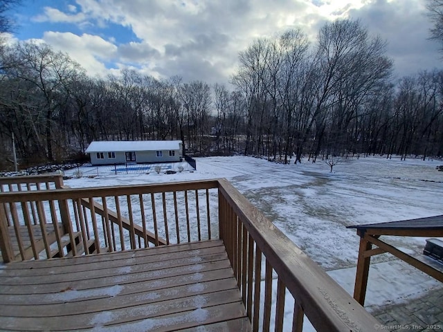 view of snow covered deck