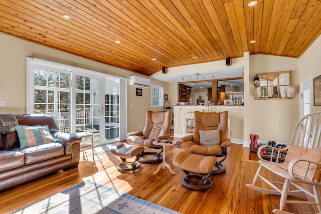 living room featuring vaulted ceiling, hardwood / wood-style flooring, a wall mounted air conditioner, and wooden ceiling