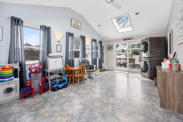 garage featuring ceiling fan and stacked washing maching and dryer