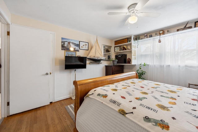 bedroom with hardwood / wood-style flooring and ceiling fan