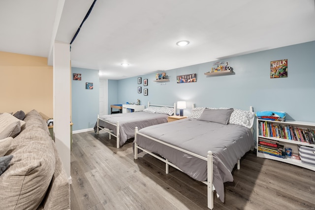 bedroom with hardwood / wood-style floors