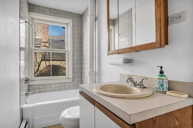 bathroom featuring a bathtub, toilet, and vanity