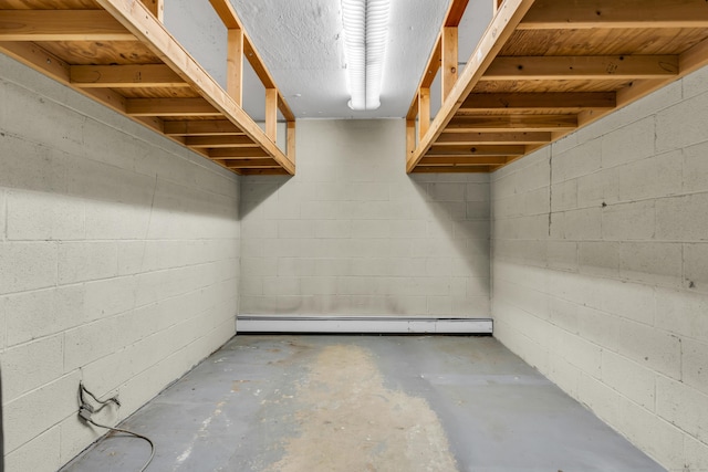 unfinished basement featuring baseboard heating