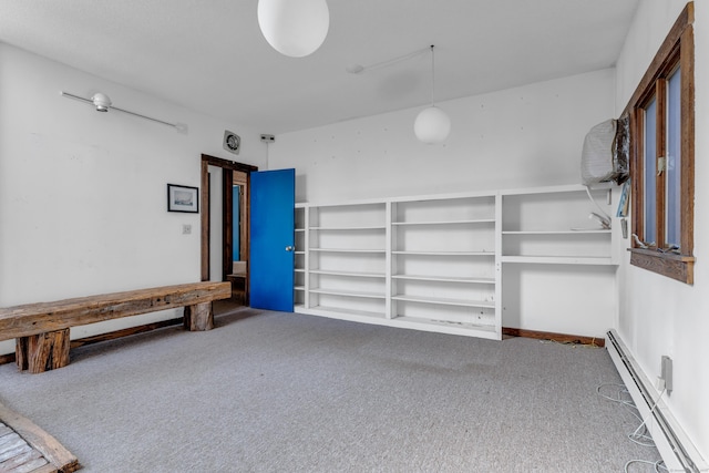 garage featuring a baseboard heating unit