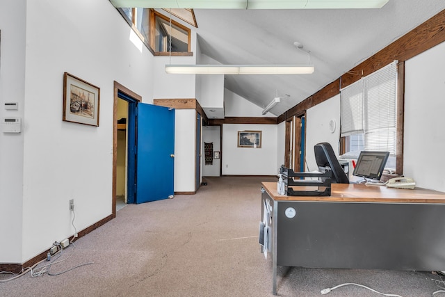 carpeted office space featuring baseboards and high vaulted ceiling