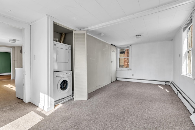 interior space featuring a baseboard heating unit, a baseboard radiator, baseboard heating, and stacked washing maching and dryer