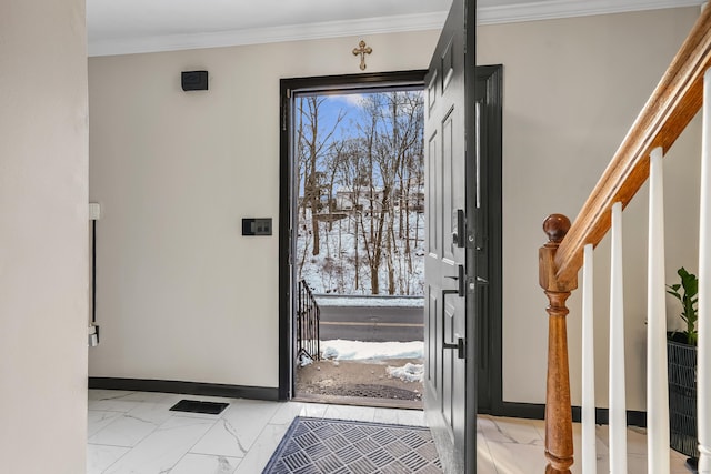 entrance foyer featuring crown molding