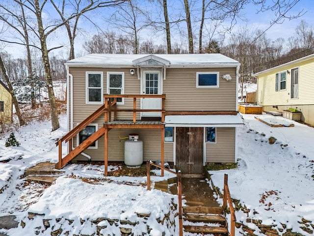 view of snow covered house