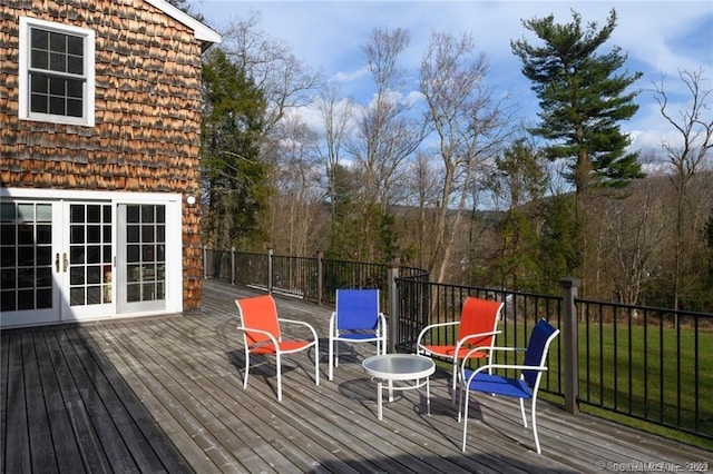 wooden deck featuring french doors