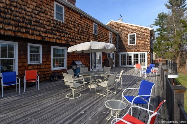 deck with grilling area and french doors