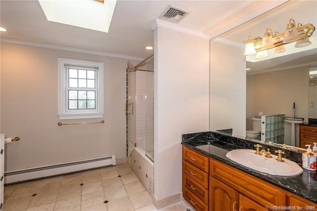 full bathroom featuring toilet, tiled shower / bath, baseboard heating, ornamental molding, and vanity