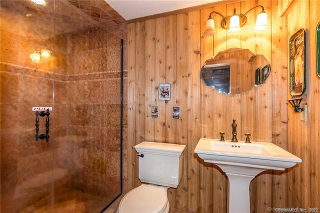 bathroom featuring wooden walls and toilet