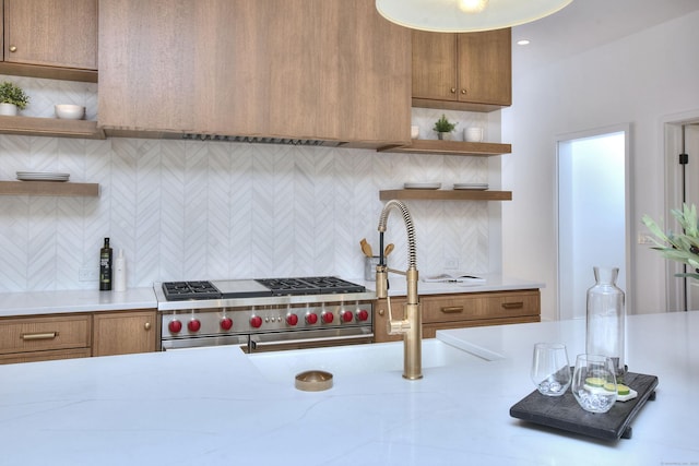 kitchen featuring brown cabinetry, double oven range, open shelves, and decorative backsplash