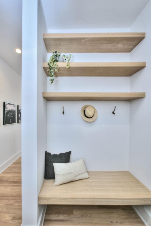 mudroom featuring baseboards, wood finished floors, and recessed lighting