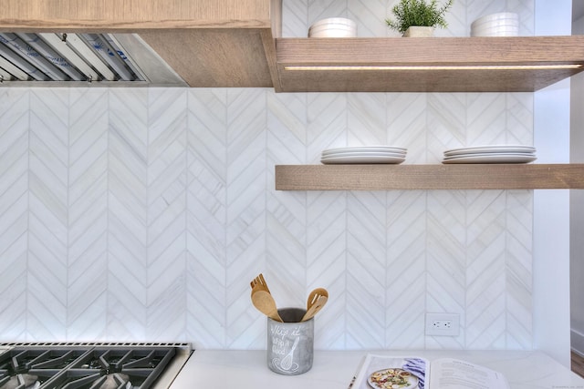 room details featuring light countertops and gas stovetop