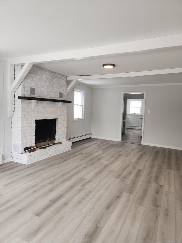 unfurnished living room with beamed ceiling, a brick fireplace, a baseboard heating unit, and wood finished floors