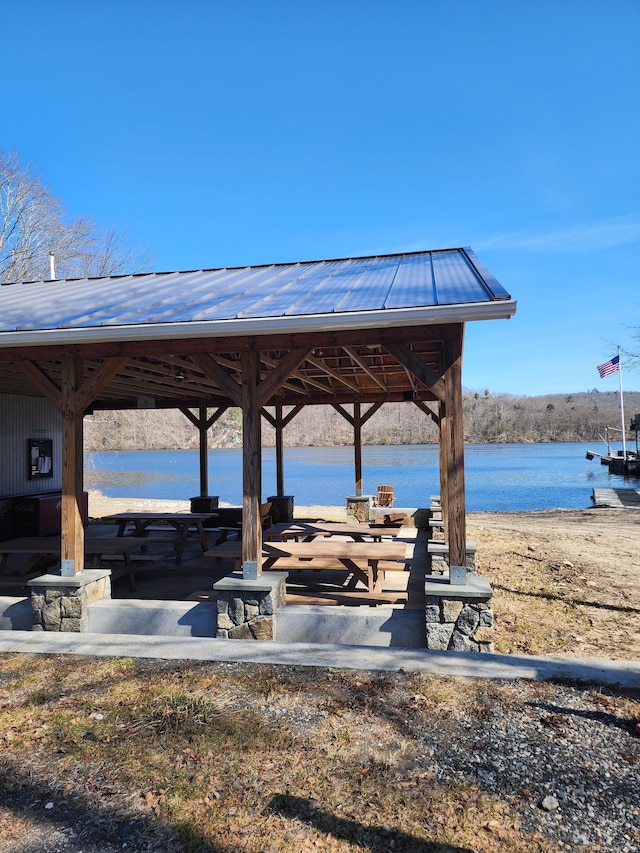 view of home's community with a gazebo and a water view