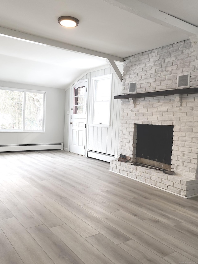 unfurnished living room featuring wood finished floors, a baseboard radiator, visible vents, and lofted ceiling