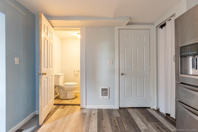 bathroom featuring hardwood / wood-style floors and toilet