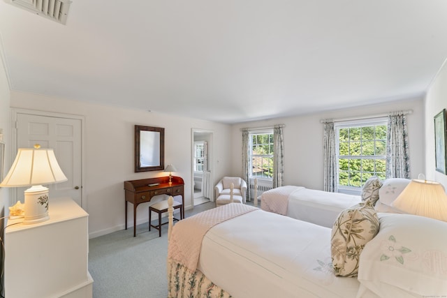 bedroom with carpet, visible vents, and baseboards