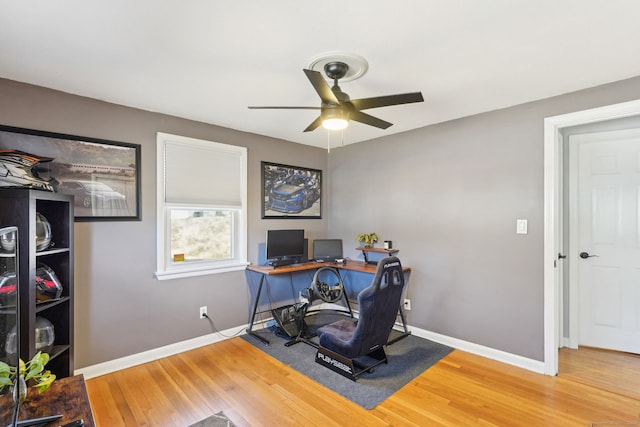 office with wood finished floors, a ceiling fan, and baseboards