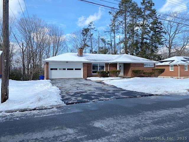 single story home featuring a garage