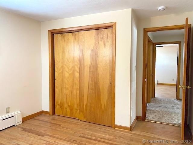 closet featuring baseboard heating