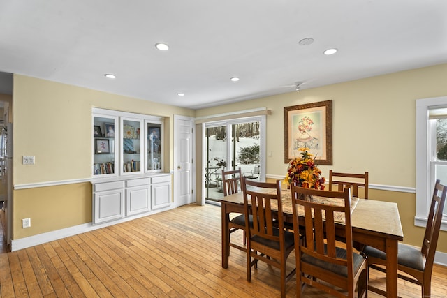 dining space featuring light wood-type flooring