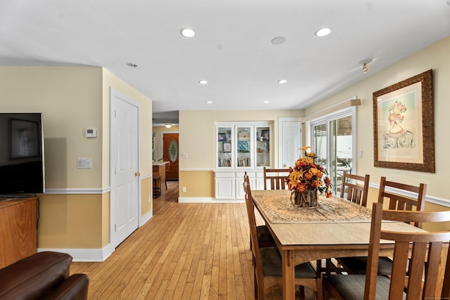 dining area featuring light wood-type flooring