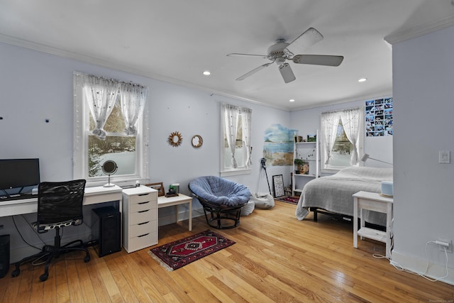 bedroom featuring ornamental molding and hardwood / wood-style floors