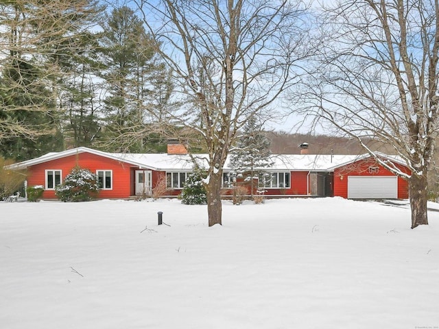 ranch-style house featuring a garage