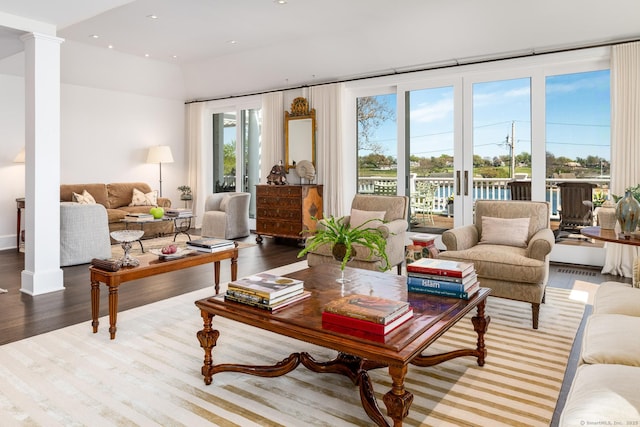 1060 Harbor Rd, Fairfield, CT 06890 - living area featuring decorative columns, plenty of natural light, wood finished floors, and recessed lighting