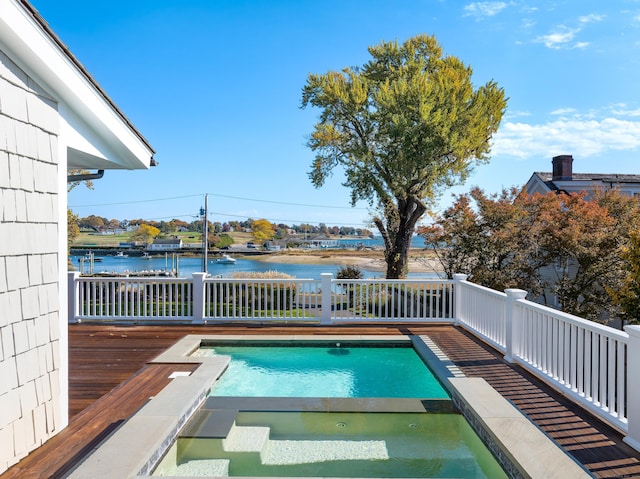 1060 Harbor Rd, Fairfield, CT 06890 - view of pool with a pool with connected hot tub and a deck with water view