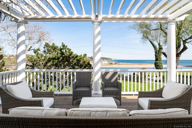 1060 Harbor Rd, Fairfield, CT 06890 - deck featuring view of water and beach, a pergola, and an outdoor living space
