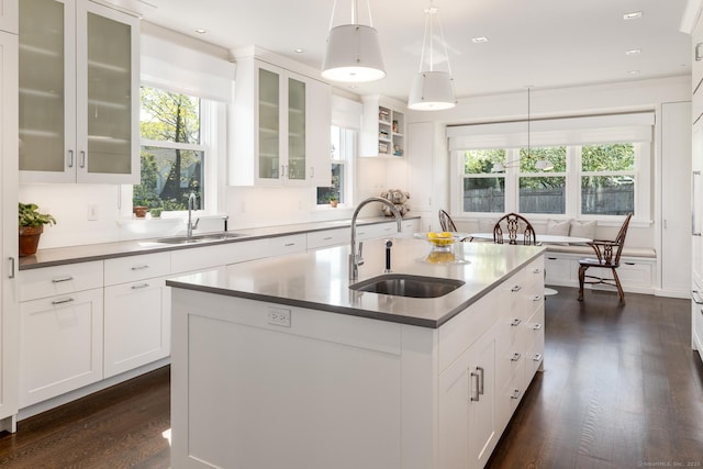 1060 Harbor Rd, Fairfield, CT 06890 - kitchen with a sink, a center island with sink, white cabinets, healthy amount of natural light, and recessed lighting